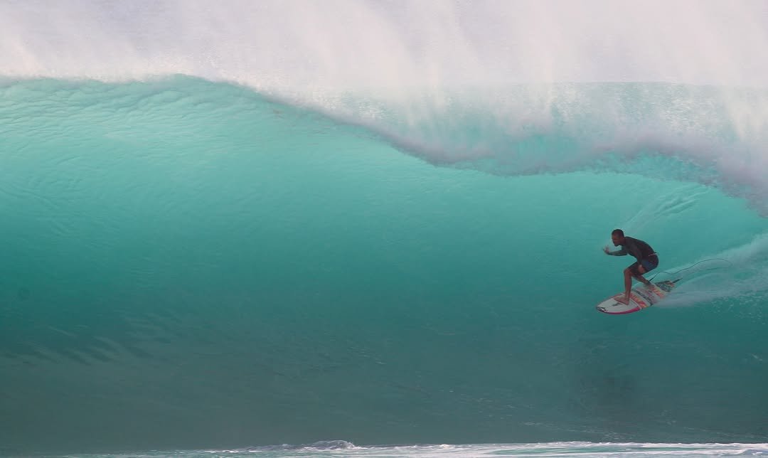 Photo by Pete Hodgson on April 08, 2026. May be an image of surfboard, wetsuit, water, ocean and text.