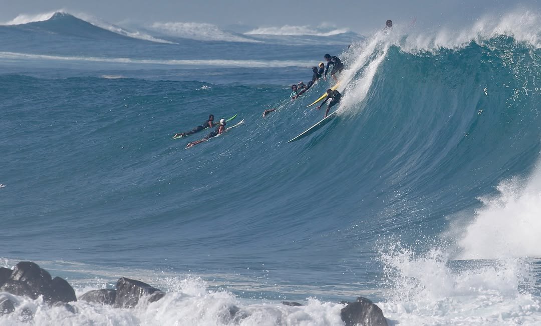 Photo by Pete Hodgson on November 30, 2025. May be an image of surfboard, ocean, water and text.