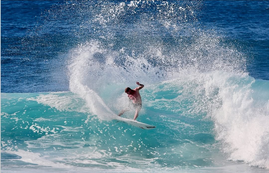 Photo by Pete Hodgson on January 05, 2026. May be an image of surfboard, water, ocean and text.