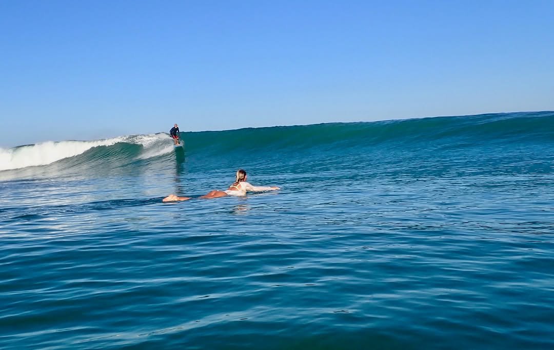 Photo by Pete Hodgson on April 01, 2026. May be an image of surfboard, wetsuit, ocean and text.