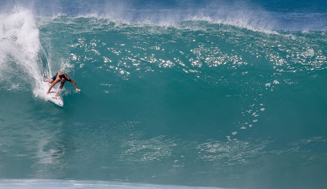 Photo by Pete Hodgson on December 03, 2025. May be an image of surfboard, wetsuit, water, ocean and text.