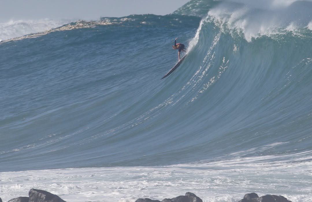 Photo by Pete Hodgson on February 21, 2026. May be an image of surfboard, water, ocean and text.