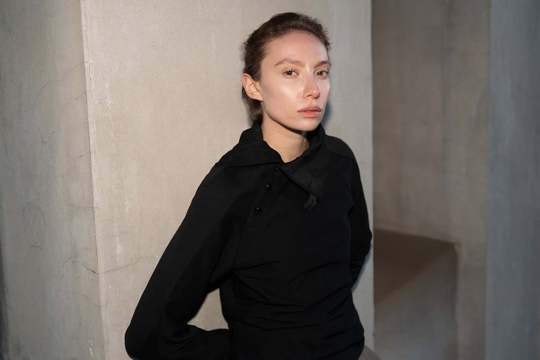 Photo by FÖRMLICH (폼리쉬) on November 10, 2025. May be an image of one or more people, makeup, turtleneck, coat and text.