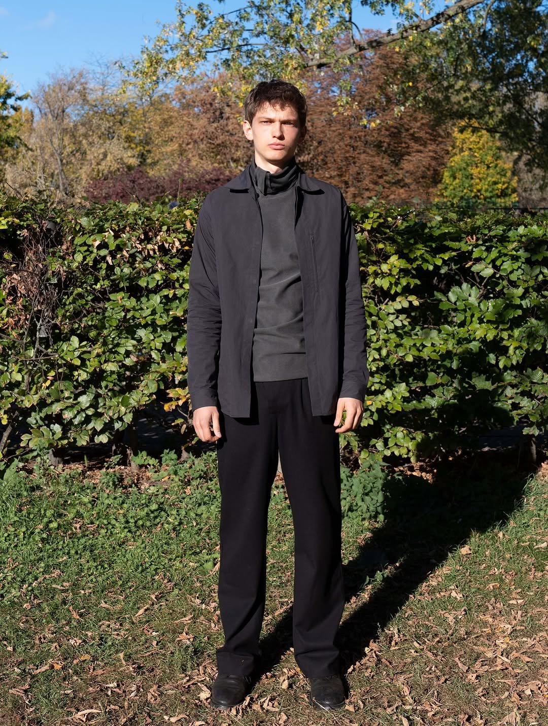 Photo by FÖRMLICH (폼리쉬) on November 18, 2025. May be an image of overcoat, cardigan, turtleneck and text.