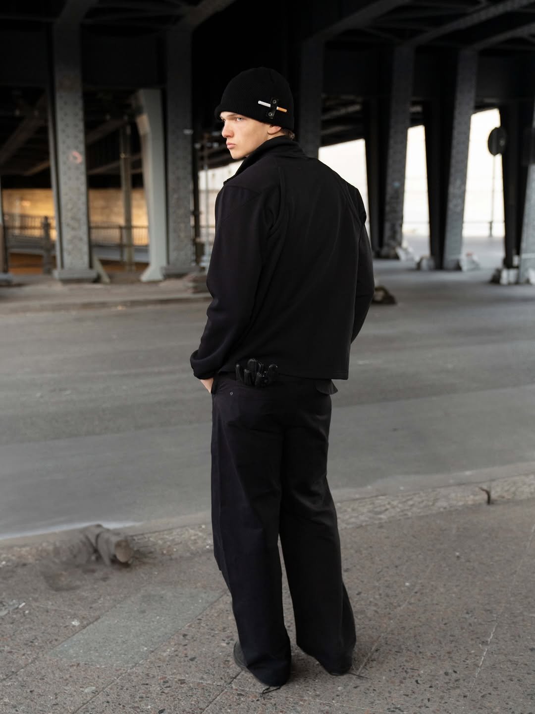 Photo by FÖRMLICH (폼리쉬) on December 11, 2025. May be an image of standing, outerwear, sweatpants, street and text.