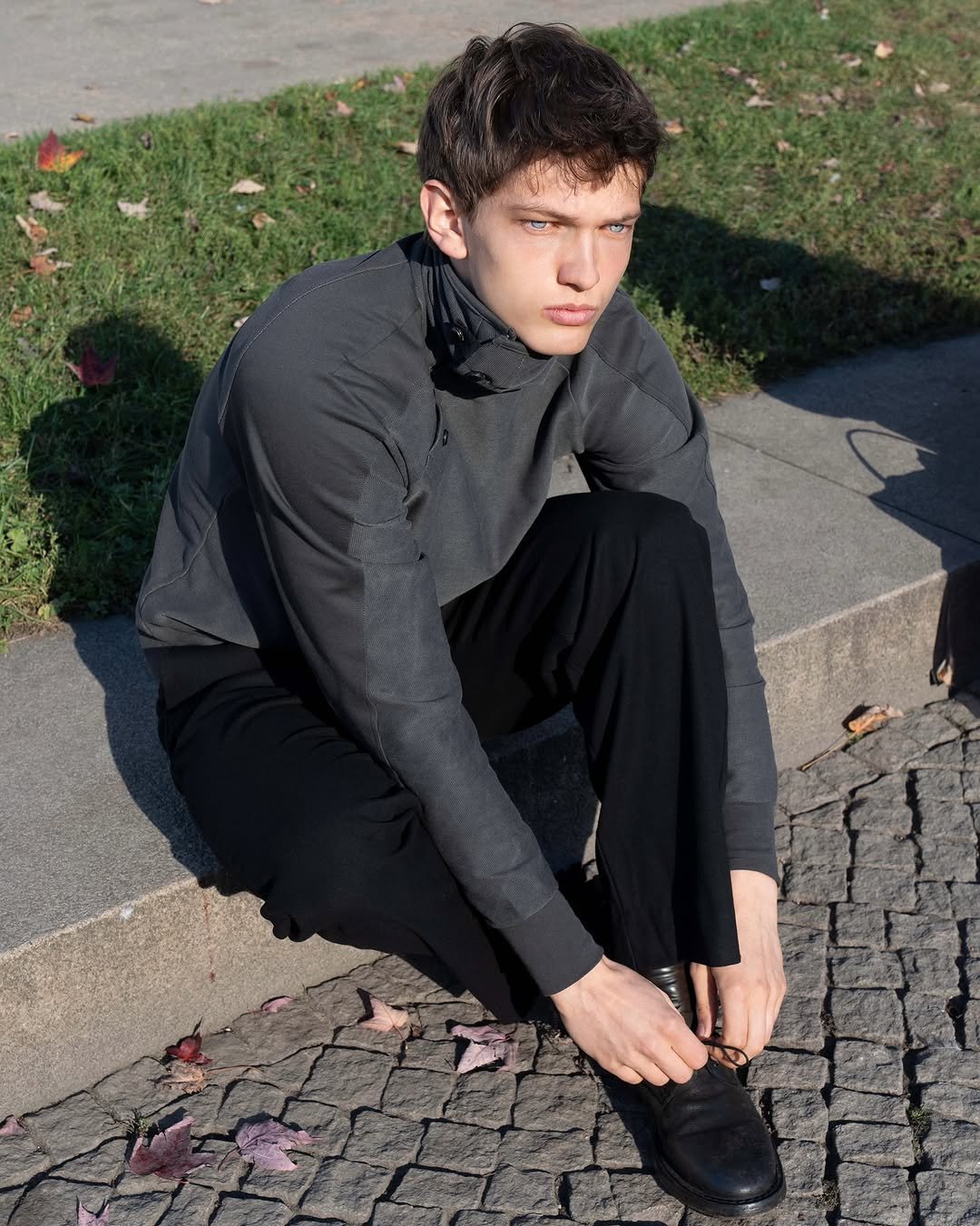 Photo by FÖRMLICH (폼리쉬) on November 18, 2025. May be an image of one or more people, wingtip shoes, cardigan, turtleneck, outerwear and text.