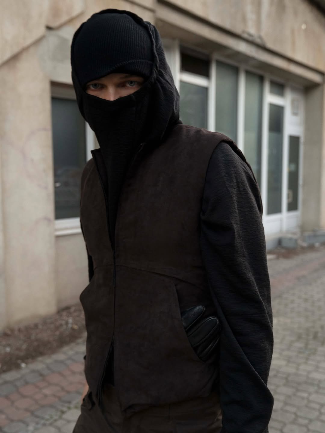 Photo by FÖRMLICH (폼리쉬) on December 11, 2025. May be an image of face mask, cloak, costume, gas mask and text.