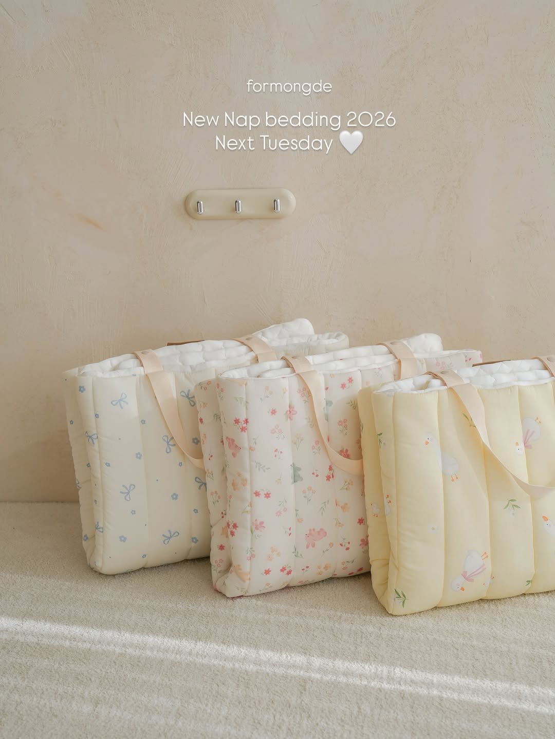 Photo by 포몽드 · 낮잠이불 쿨매트 아기침구♥ on December 30, 2025. May be an image of sleepwear, blanket, baby bed, pencil case, diaper, pouch and text that says 'formongde New NewNapbedding2026 NewNap Nap bedding 2026 Next Tuesday 0 do deo'.