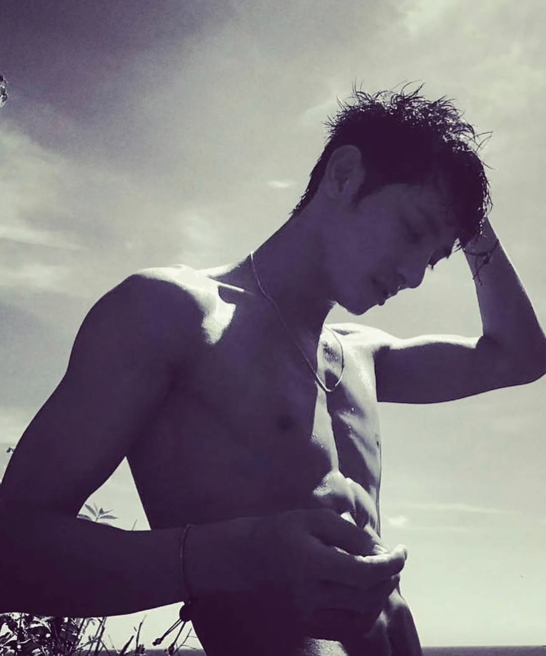 Photo shared by Lee Soo Hyuk Australia (fanpage) on March 19, 2026 tagging @leesoohyuk. May be a black-and-white image of one or more people, biceps, hair, beach and text.