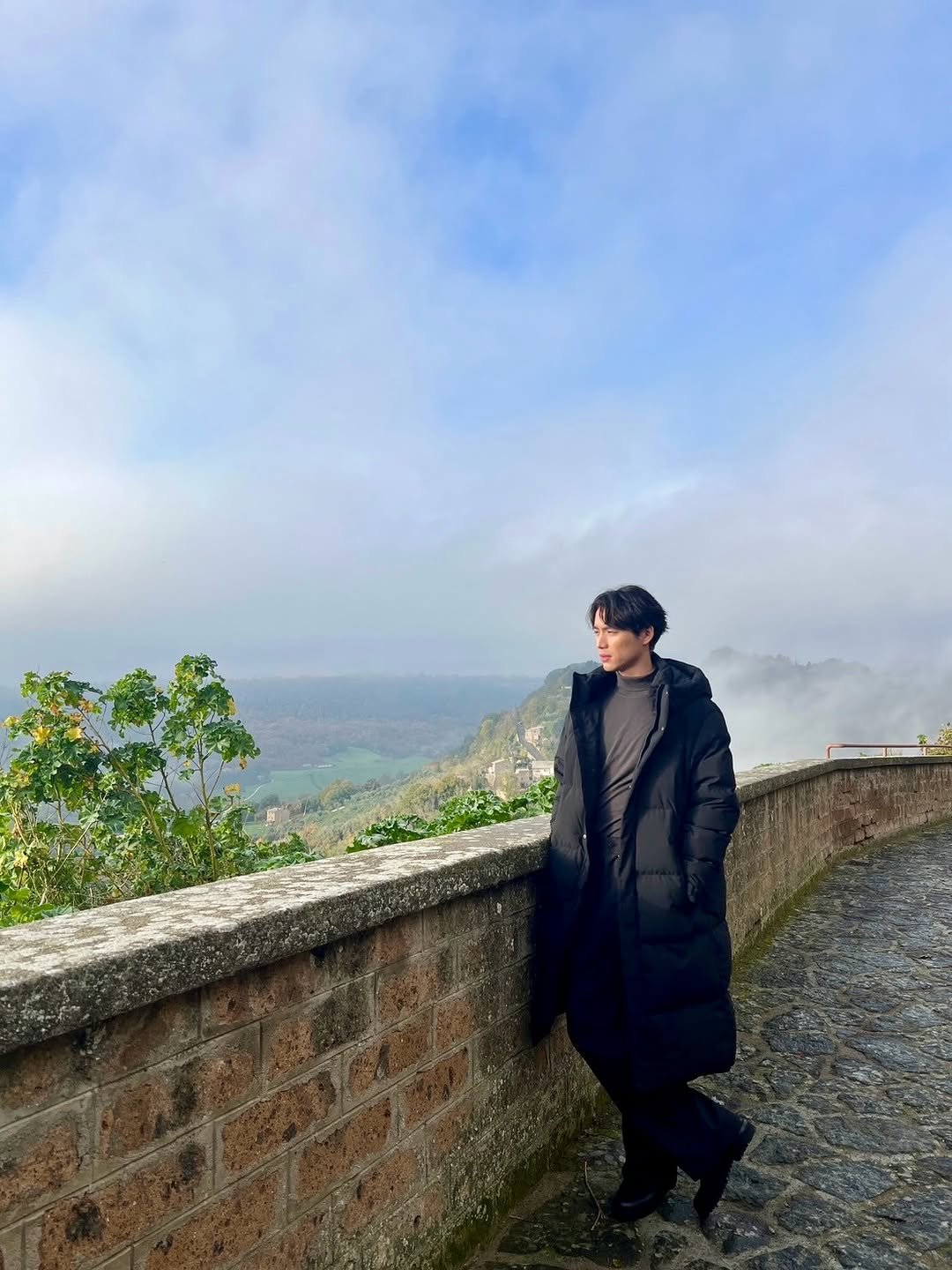 Photo shared by Sota Fukushi on February 15, 2026 tagging @netflixjp, and @netflixkr. May be an image of parka, Arthur's Seat, fog and text.