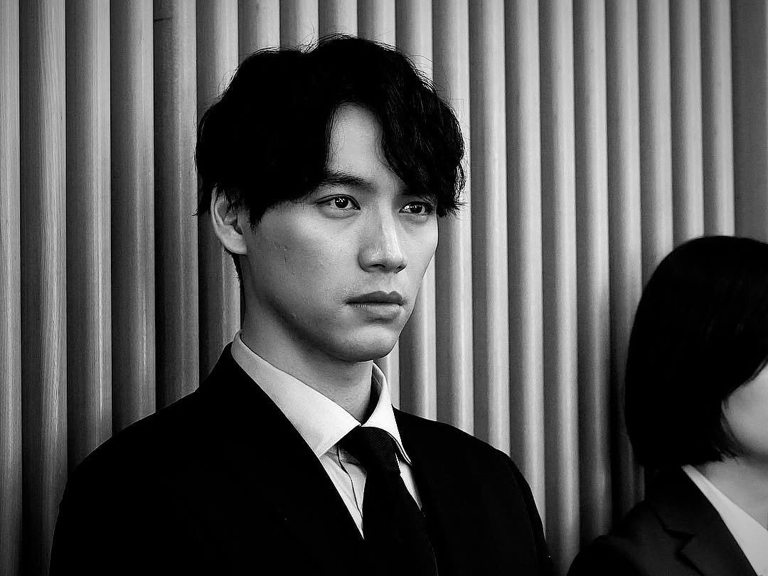 Photo shared by Sota Fukushi on February 23, 2026 tagging @tokyopd_fujitv. May be a black-and-white image of one or more people, hair, suit and text.
