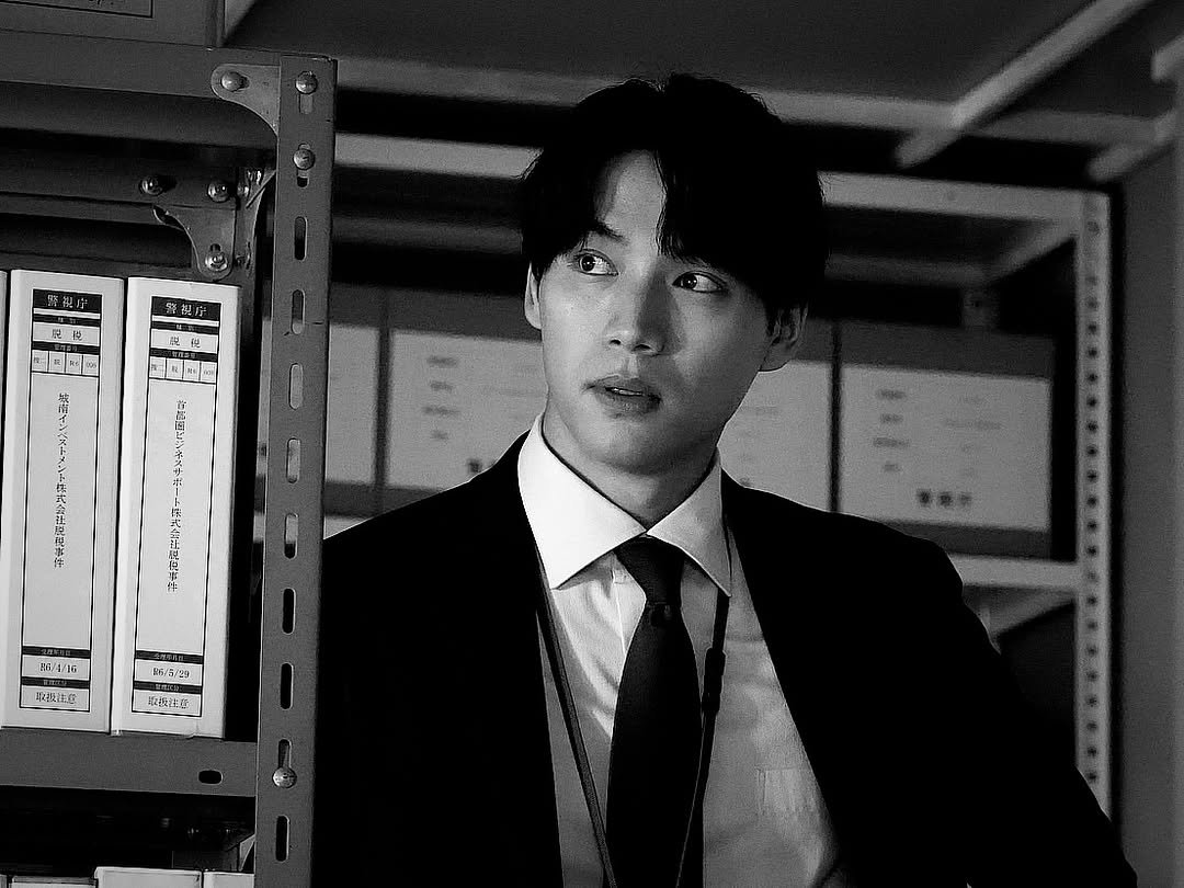 Photo by Sota Fukushi on March 10, 2026. May be a black-and-white image of one or more people, bangs, suit, bolo tie and text.