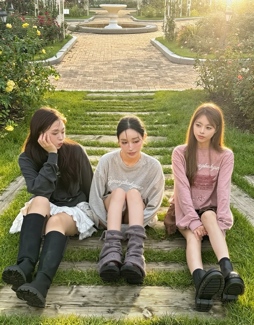 Photo by Jihye Seo on September 26, 2025. May be an image of 3 people, miniskirt, boots and text.