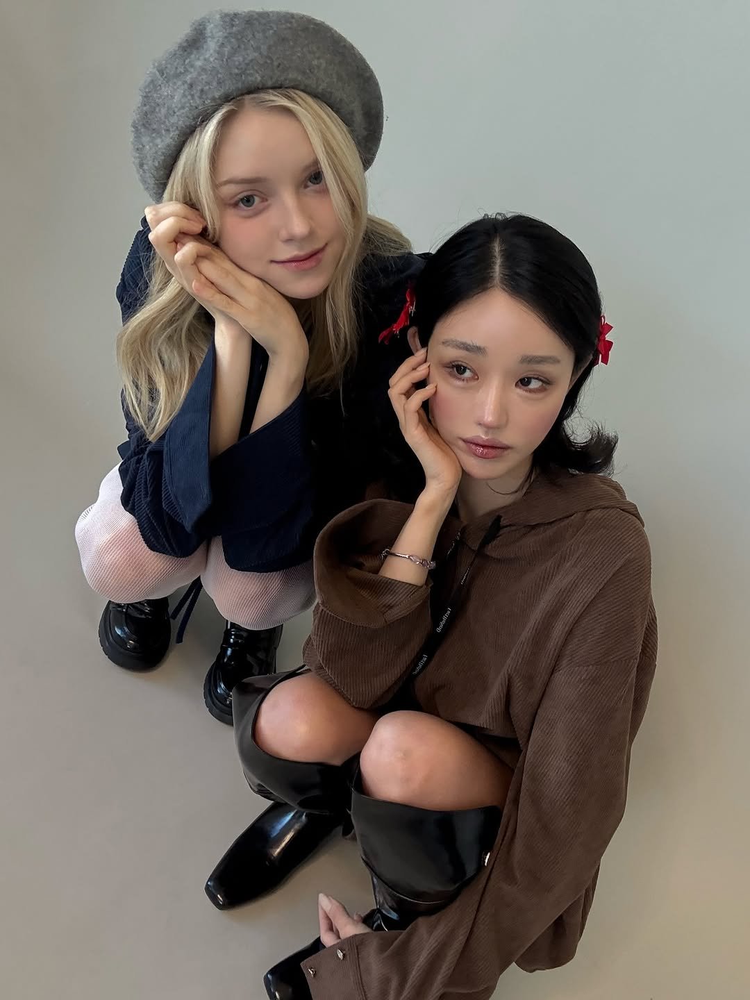 Photo by Jihye Seo on October 19, 2025. May be an image of one or more people, braids, duffle coat, beret, parka and text.