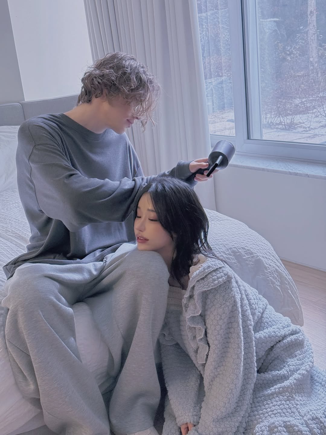 Photo by Jihye Seo on December 29, 2025. May be an image of one or more people, bangs, makeup, hair dryer, sleepwear, hair brush, robe, bath robe and text.