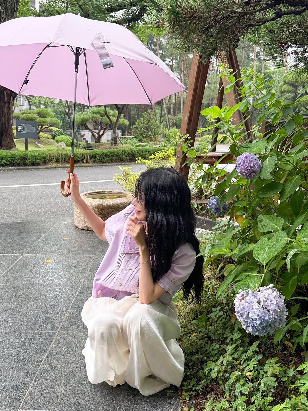 Photo by Jihye Seo on August 11, 2025. May be an image of 1 person, parasol, umbrella, scorpion grass, outdoors and text.