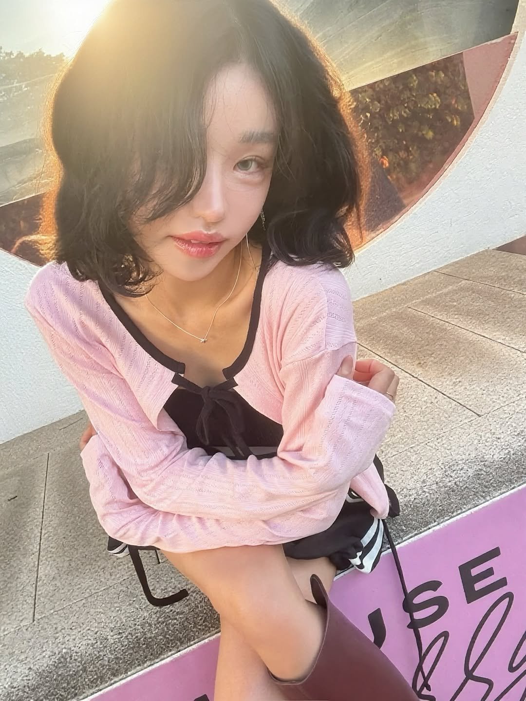 Photo by Jihye Seo on September 04, 2025. May be an image of 1 person, hair, makeup, boots, miniskirt and text.
