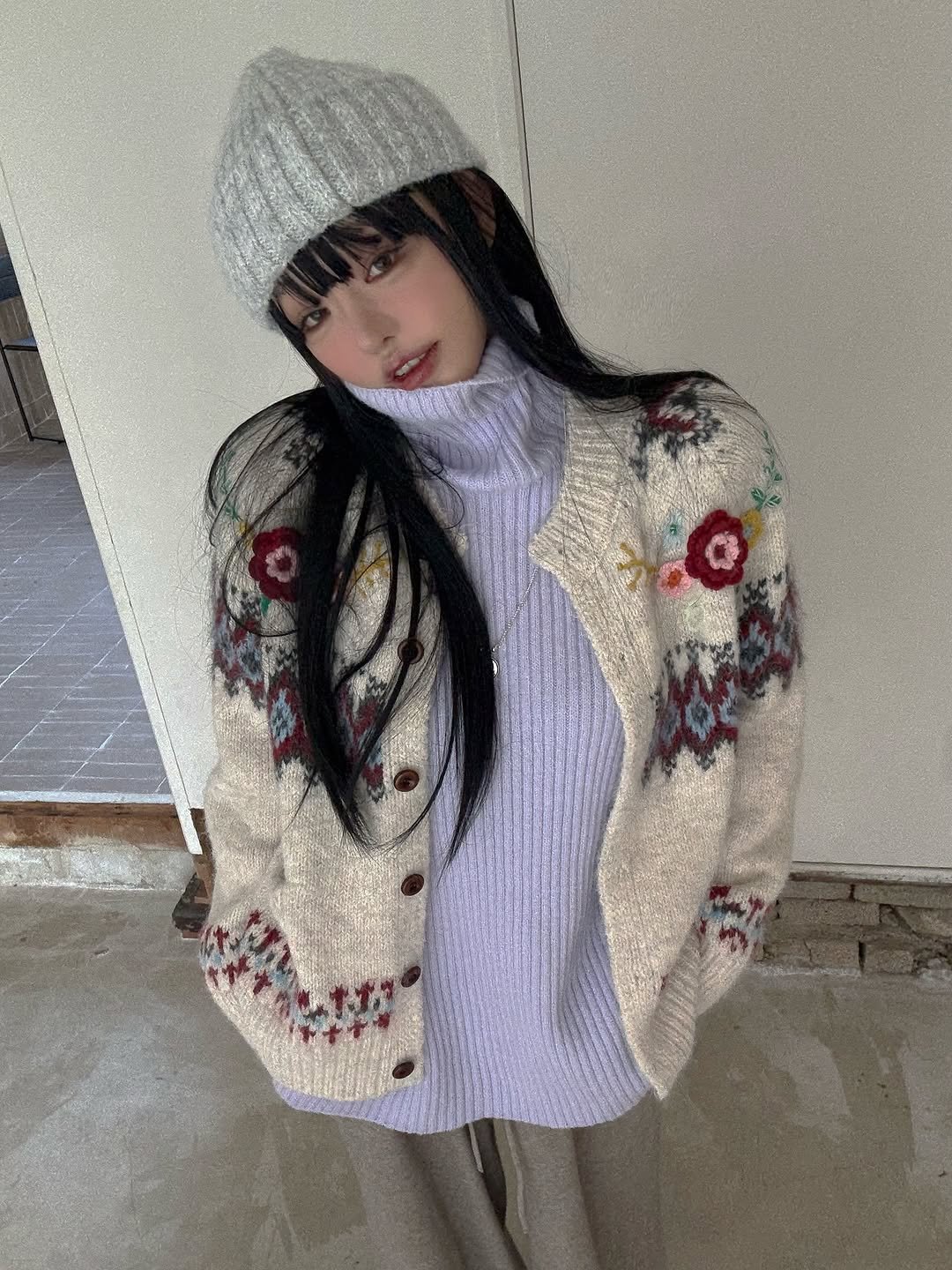 Photo by Jihye Seo on November 12, 2025. May be an image of duffle coat, parka, knit, turtleneck, cardigan, sweater and text.