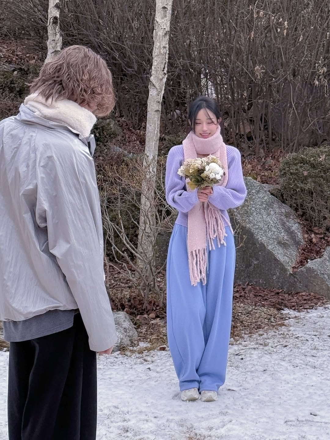 Photo by Jihye Seo on December 25, 2025. May be an image of one or more people, people standing, shawl, parka, outdoors and text.