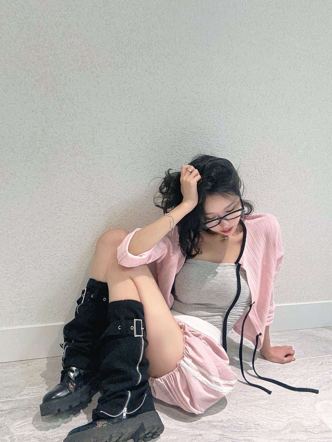 Photo by Jihye Seo on September 08, 2025. May be an image of 1 person, boots, shorts, miniskirt and text.