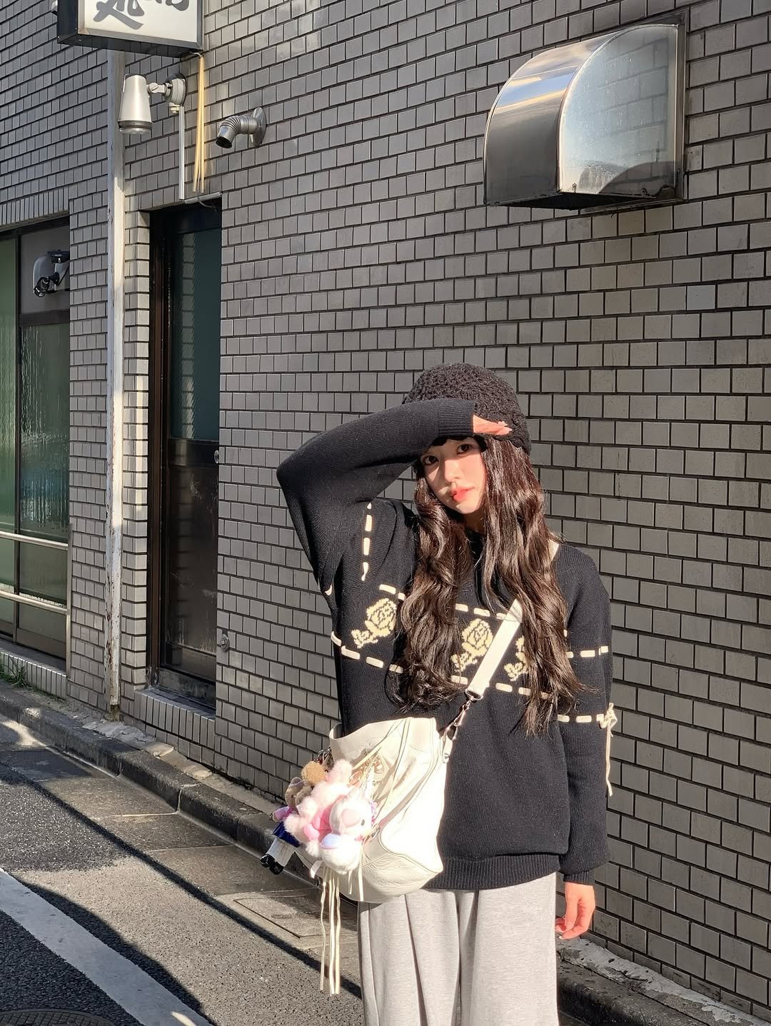 Photo shared by 지 원 on February 10, 2026 tagging @sinoon.official, and @danaburton.jewelry. May be an image of duffle coat, hat, beret, street and text.