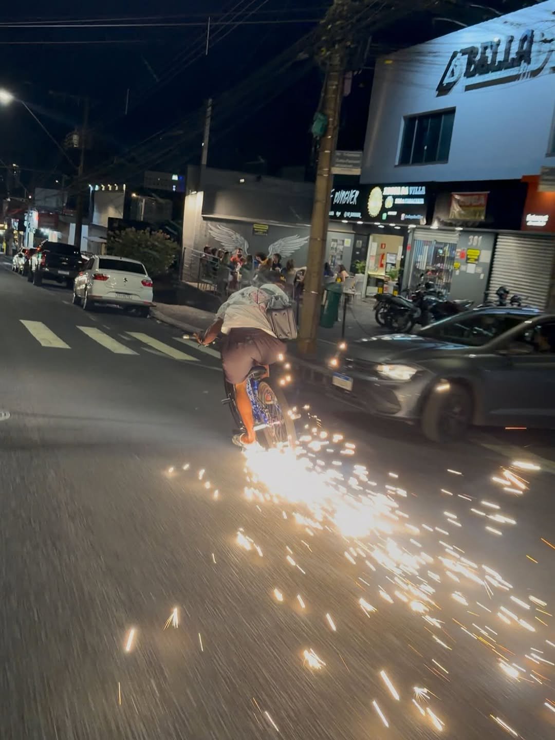 Photo by Gabriel Sena on April 27, 2026. May be an image of grinder, sparkler, fireworks, street and text.