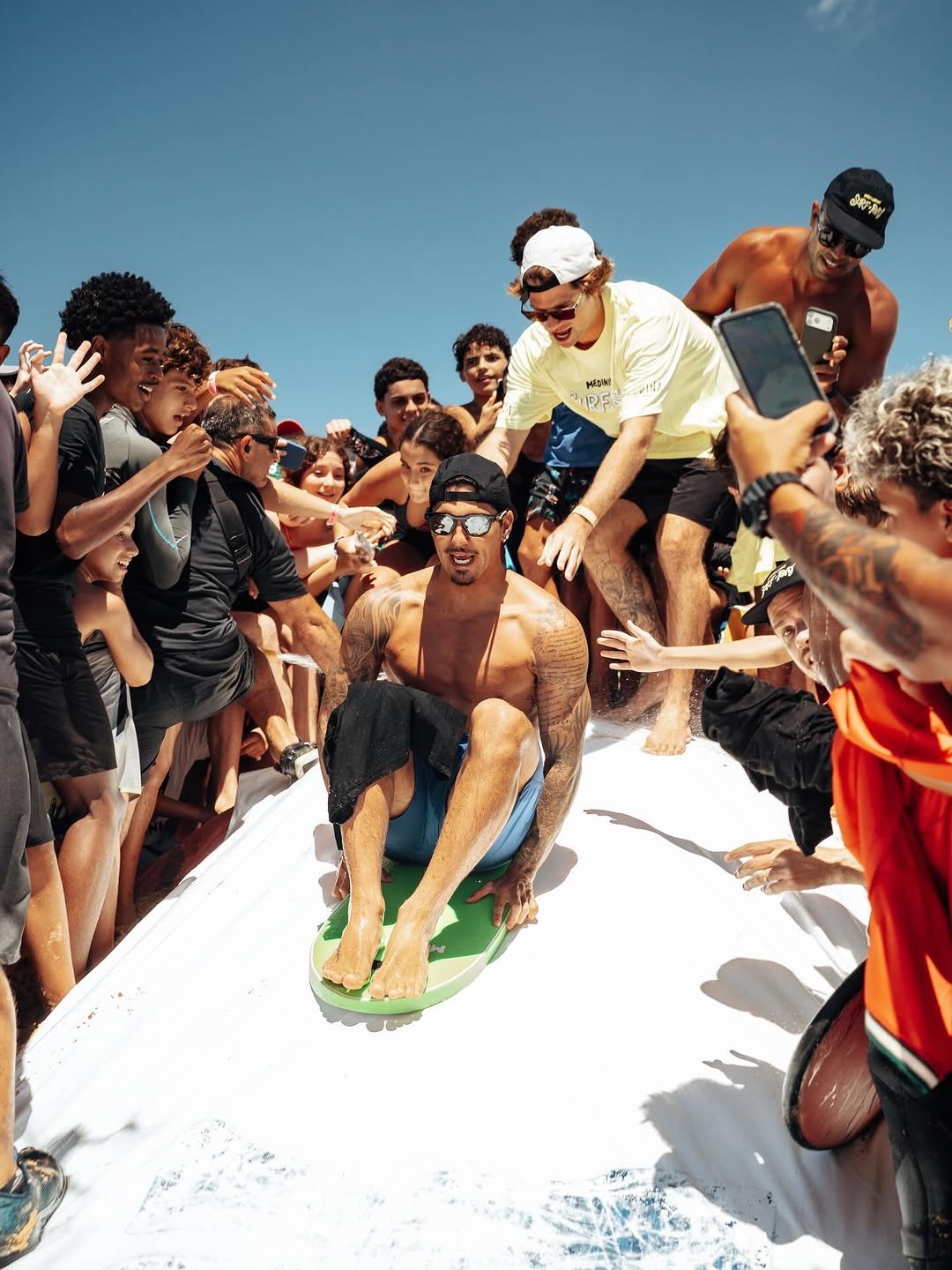 Photo by Gabriel Medina on February 22, 2026. May be an image of one or more people, jet ski, raft, crowd and text.