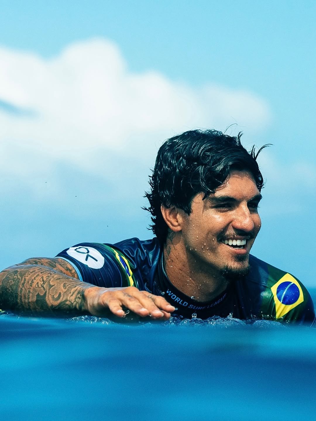 Photo by Gabriel Medina on December 23, 2025. May be an image of surfboard, wetsuit, water and text.