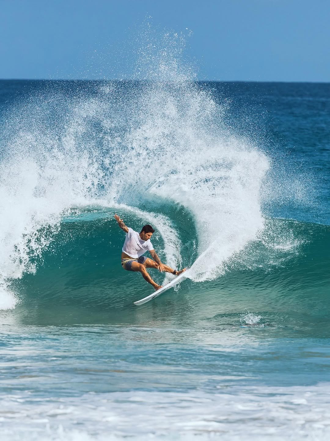 Photo by Gabriel Medina on February 18, 2026. May be an image of surfboard, ocean, water and text.