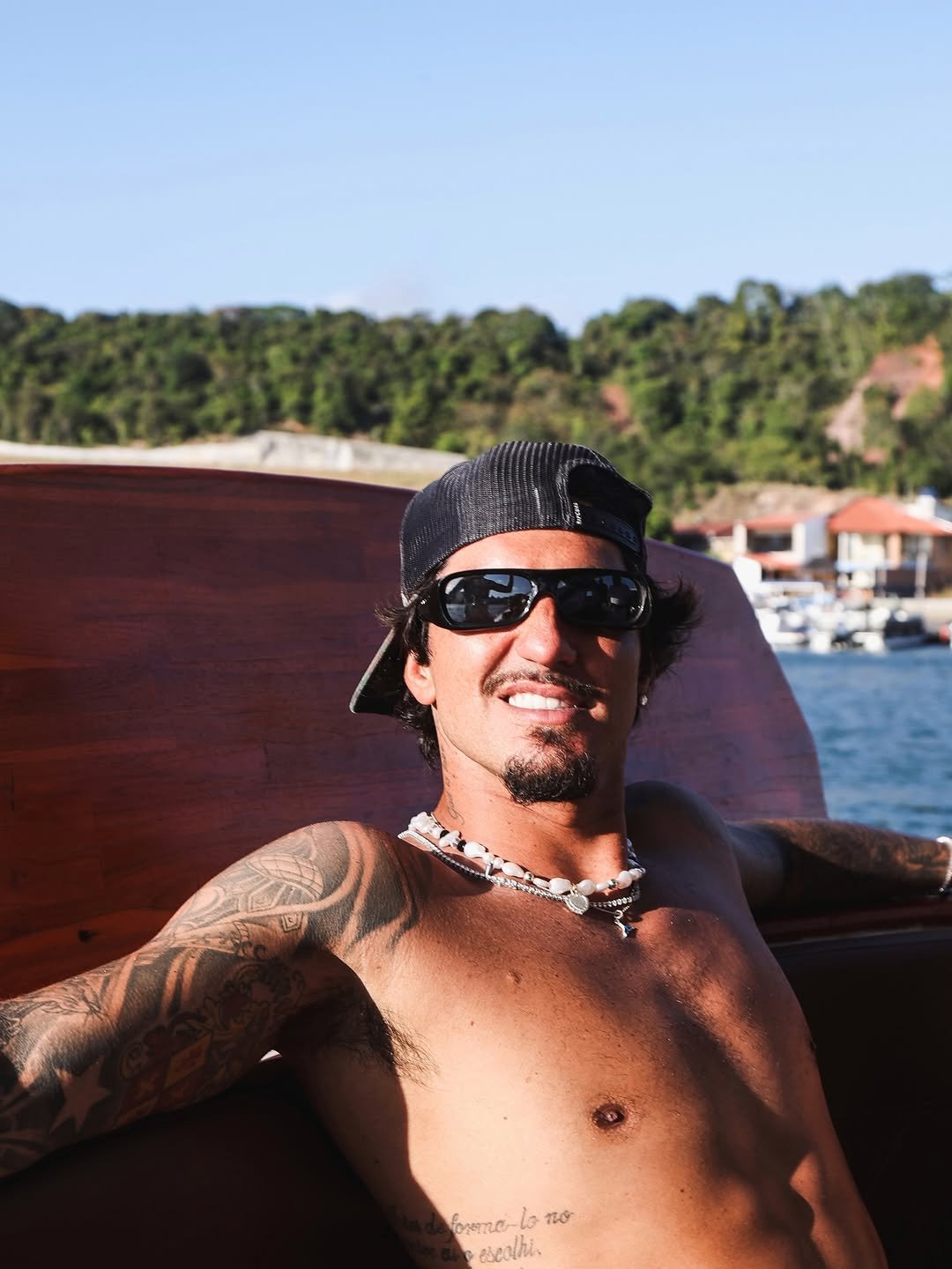 Photo by Gabriel Medina on December 30, 2025. May be an image of jet ski, boat, glasses, bandanna, houseboat and text.