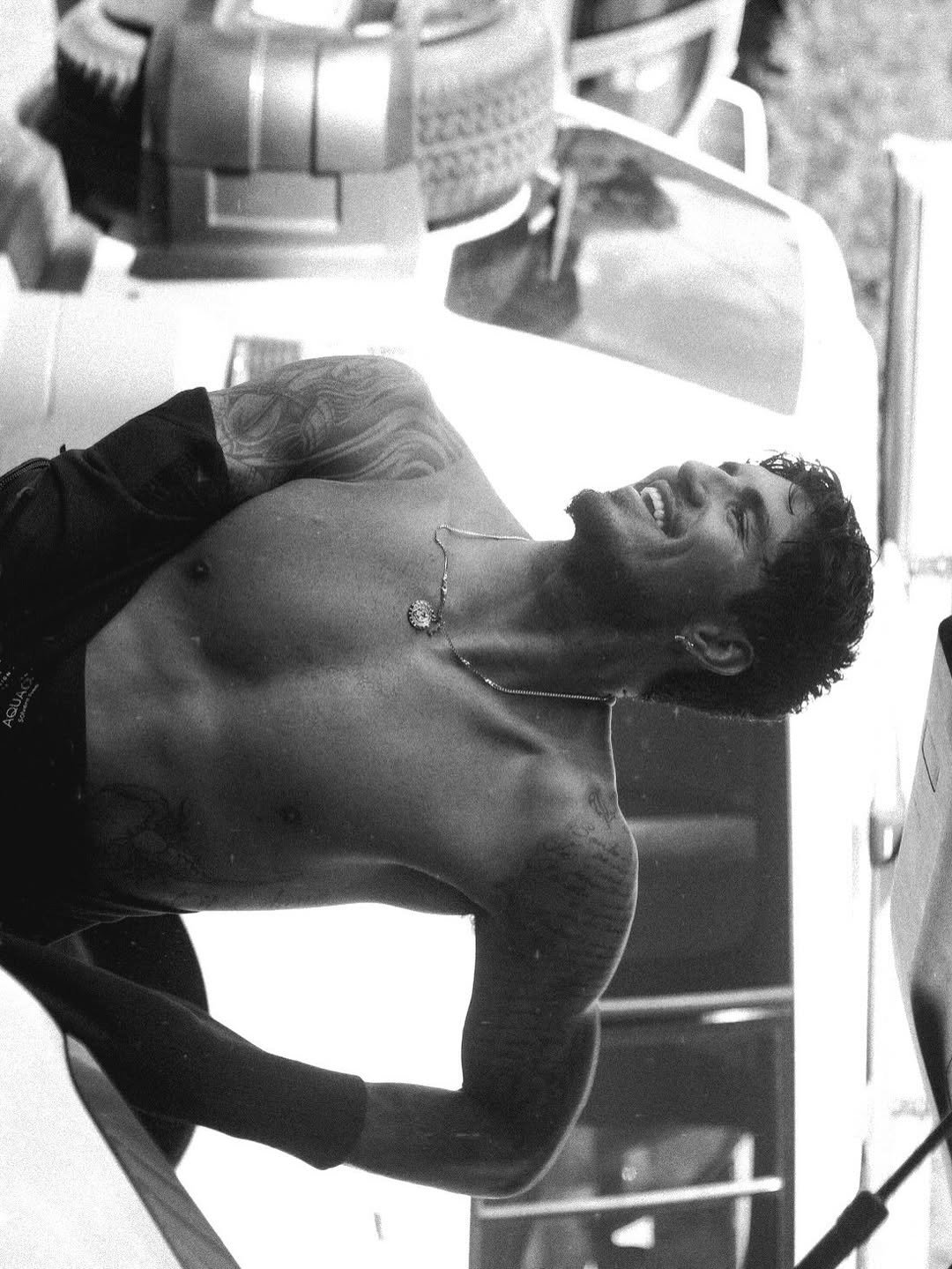 Photo by Gabriel Medina on April 24, 2026. May be a black-and-white image of one or more people, biceps, underwear and text.