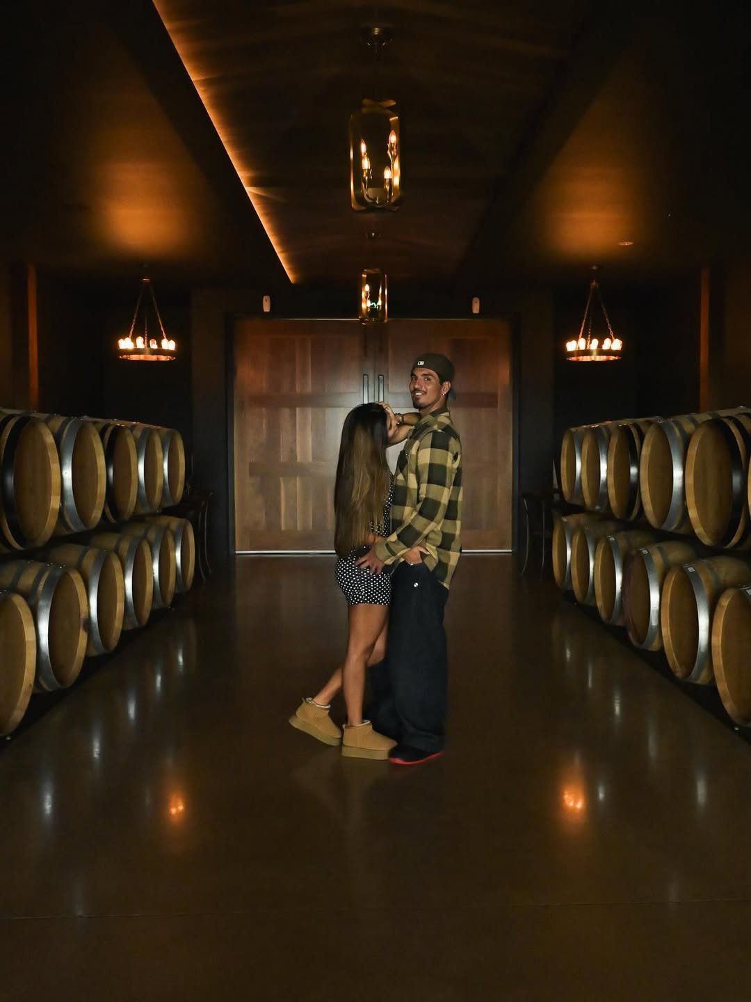 Photo by Gabriel Medina on April 22, 2026. May be an image of people kissing, wine glass and text.