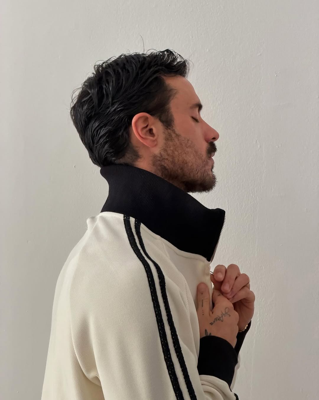 Photo shared by ga on December 05, 2025 tagging @reternity. May be an image of one or more people, jacket, sweater, turtleneck and text.