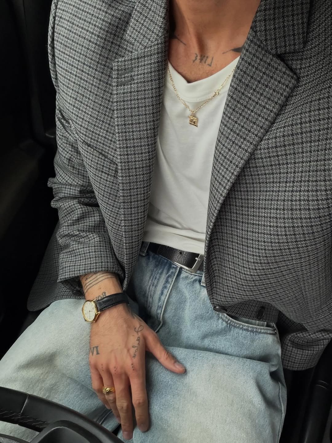 Photo shared by ga on November 24, 2025 tagging @thekooples. May be an image of wrist watch, suit, overcoat, blazer, jacket and text.