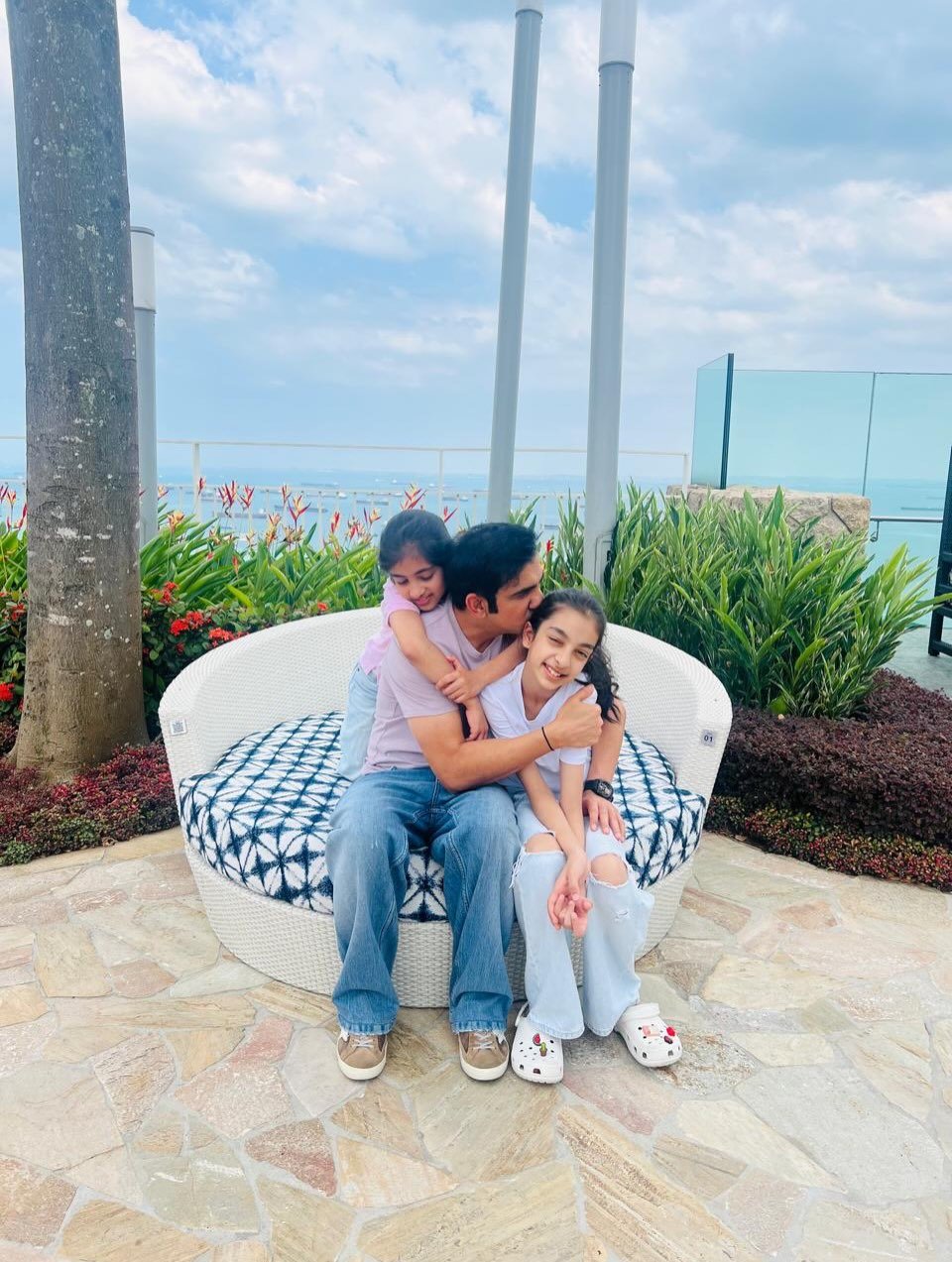 Photo by Gautam Gambhir on March 25, 2026. May be an image of baby, people kissing and text.