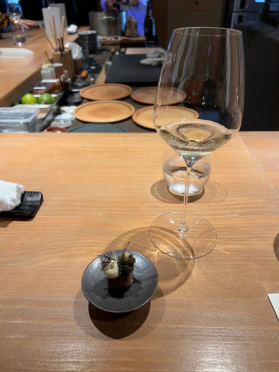 Photo by 가영 on December 25, 2025. May be an image of sushi, sashimi, wine glass and text.