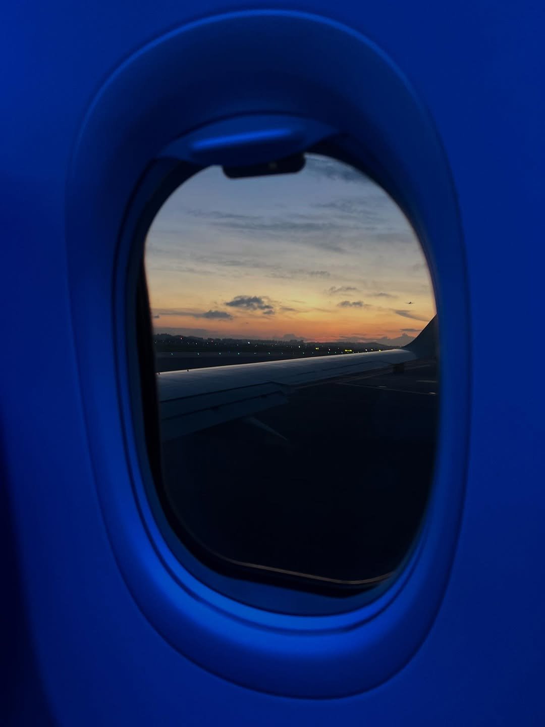 Photo by 가영 on July 28, 2025. May be an image of airplane, twilight and text.