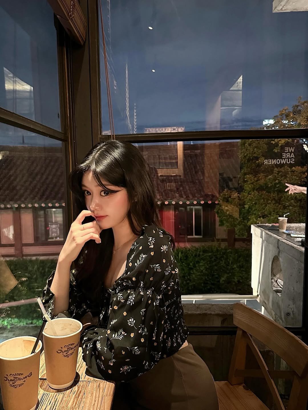Photo by 가영 on September 24, 2025. May be an image of 1 person, drink, sleepwear, cigarette, turtleneck, cornflower and text.