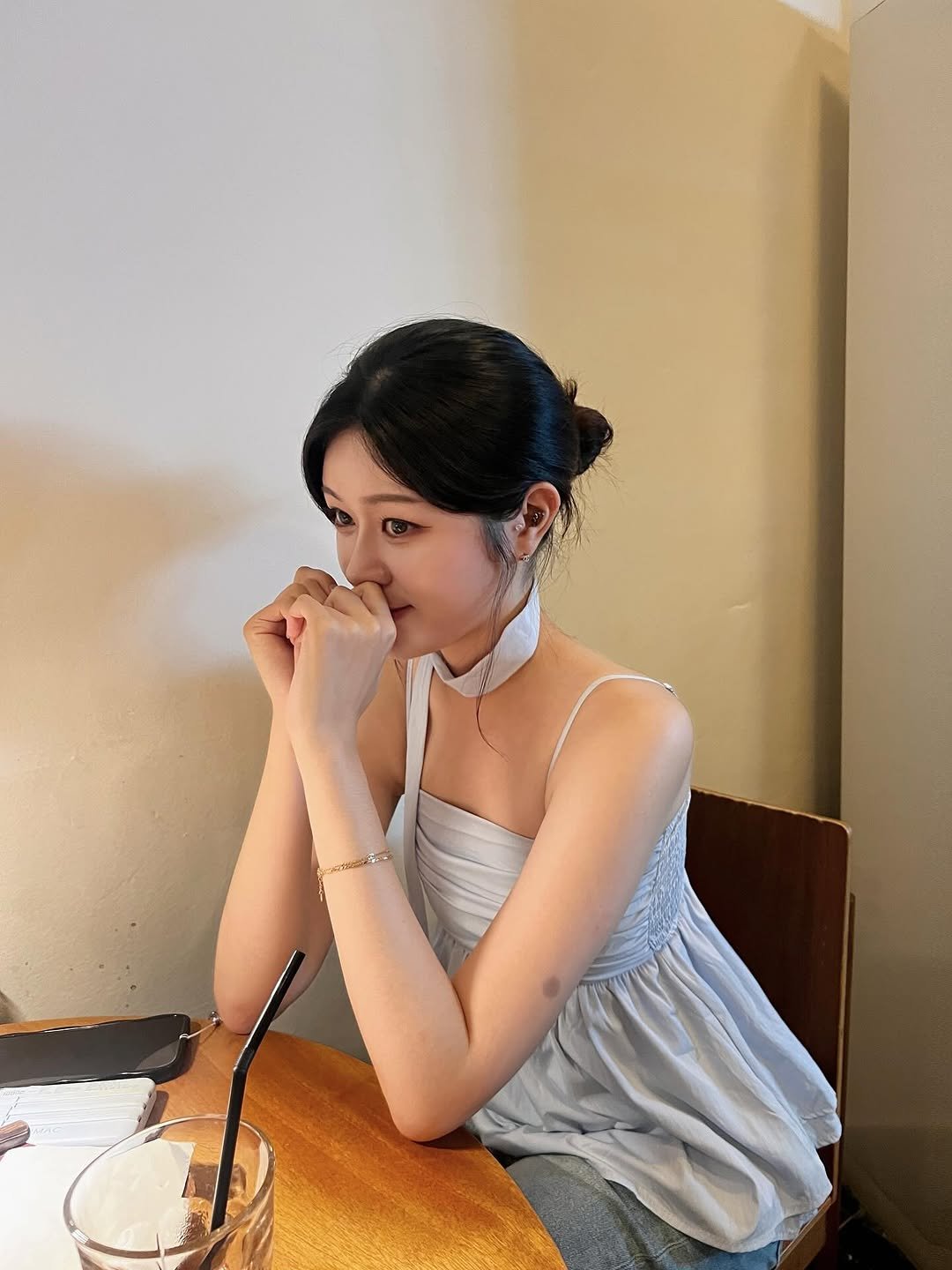 Photo by 가영 on August 24, 2025. May be an image of 1 person, hair, choker, top and text.