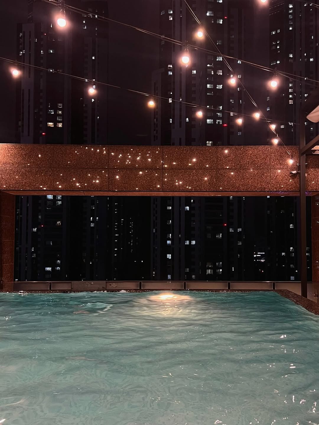 Photo by 가영 on September 07, 2025. May be an image of pool, cabana, buildings and text.
