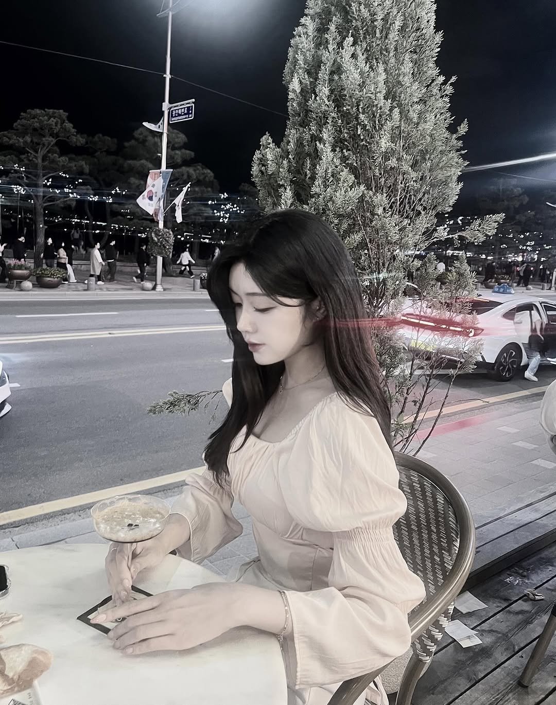 Photo by 가영 in 광안리해수욕장 GwangalliBeach, Busan, Korea 廣安里海水浴場. May be an image of one or more people, hair, dress, night, outdoors and text.