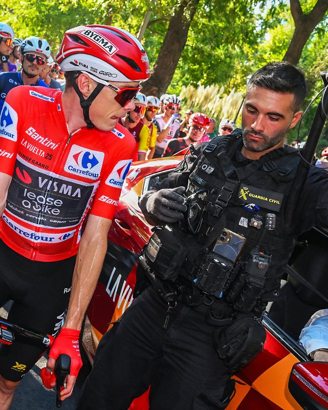 Photo by GCN Racing on September 15, 2025. May be an image of 2 people, people racing vehicles, bicycle, tire, helmet, crowd and text.
