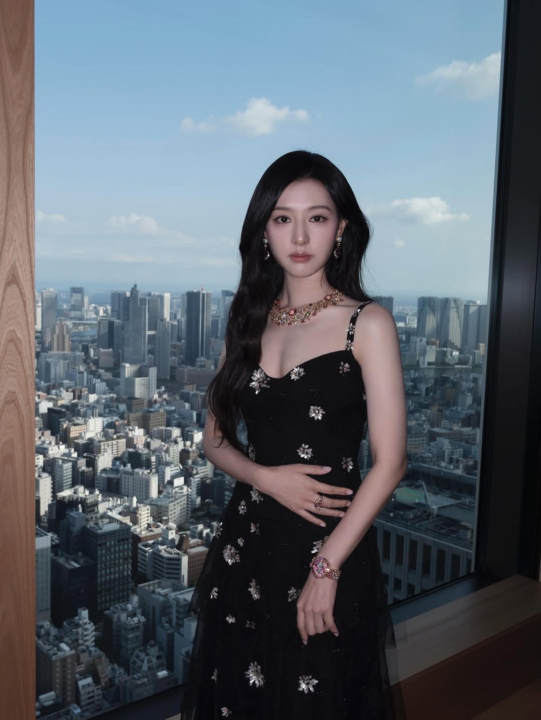 Photo shared by 김지원 on September 16, 2025 tagging @bvlgari. May be an image of 1 person, hair, dress and text.