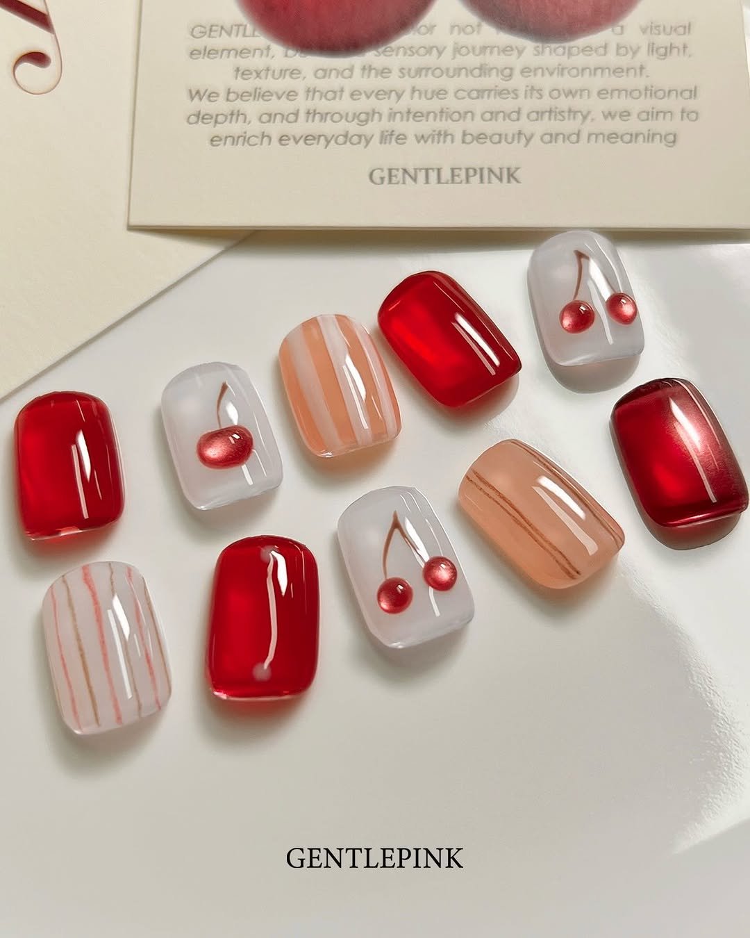 Photo by GENTLEPINK 젠틀핑크 공식 인스타그램 on April 09, 2026. May be an image of one or more people, fingernails and text that says 'GENTL or not 0 visual element, sensory joumey shoped by light. texture, and the surrounding environment We believe that every hue carries its own emotional depth, and through intention and artistry. we aim to enrich everyday life with beauty and meaning GENTLEPINK GENTLEPINK'.