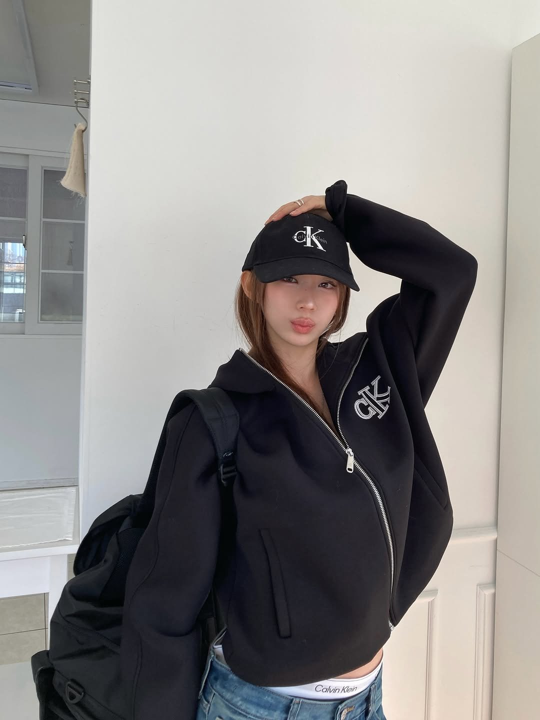 Photo shared by 은진 on February 10, 2026 tagging @calvinklein. May be an image of duffle coat, hat, jacket, top, parka, sweatshirt and text.