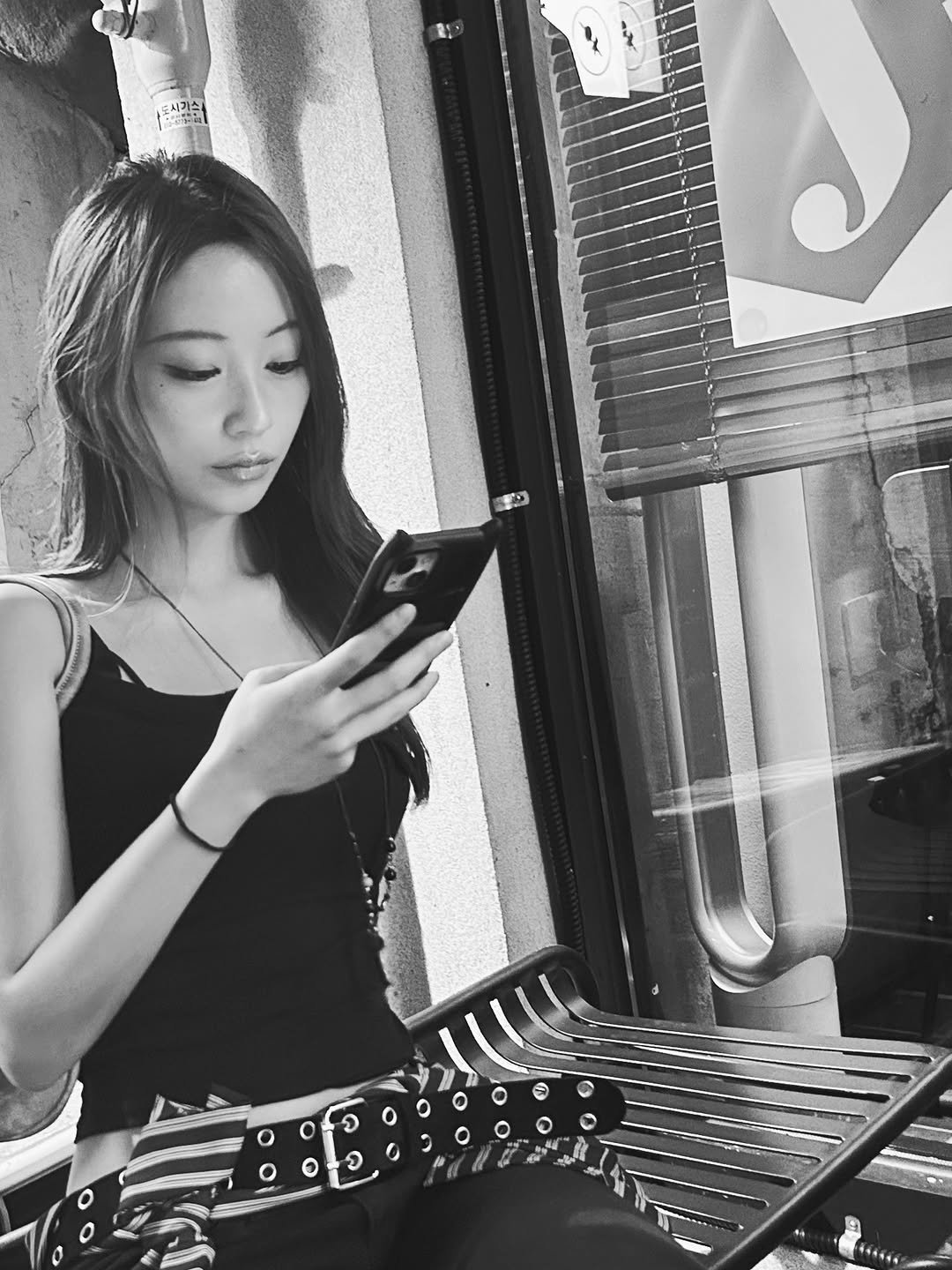 Photo by 은진 on September 27, 2025. May be a black-and-white image of 1 person, phone and text.