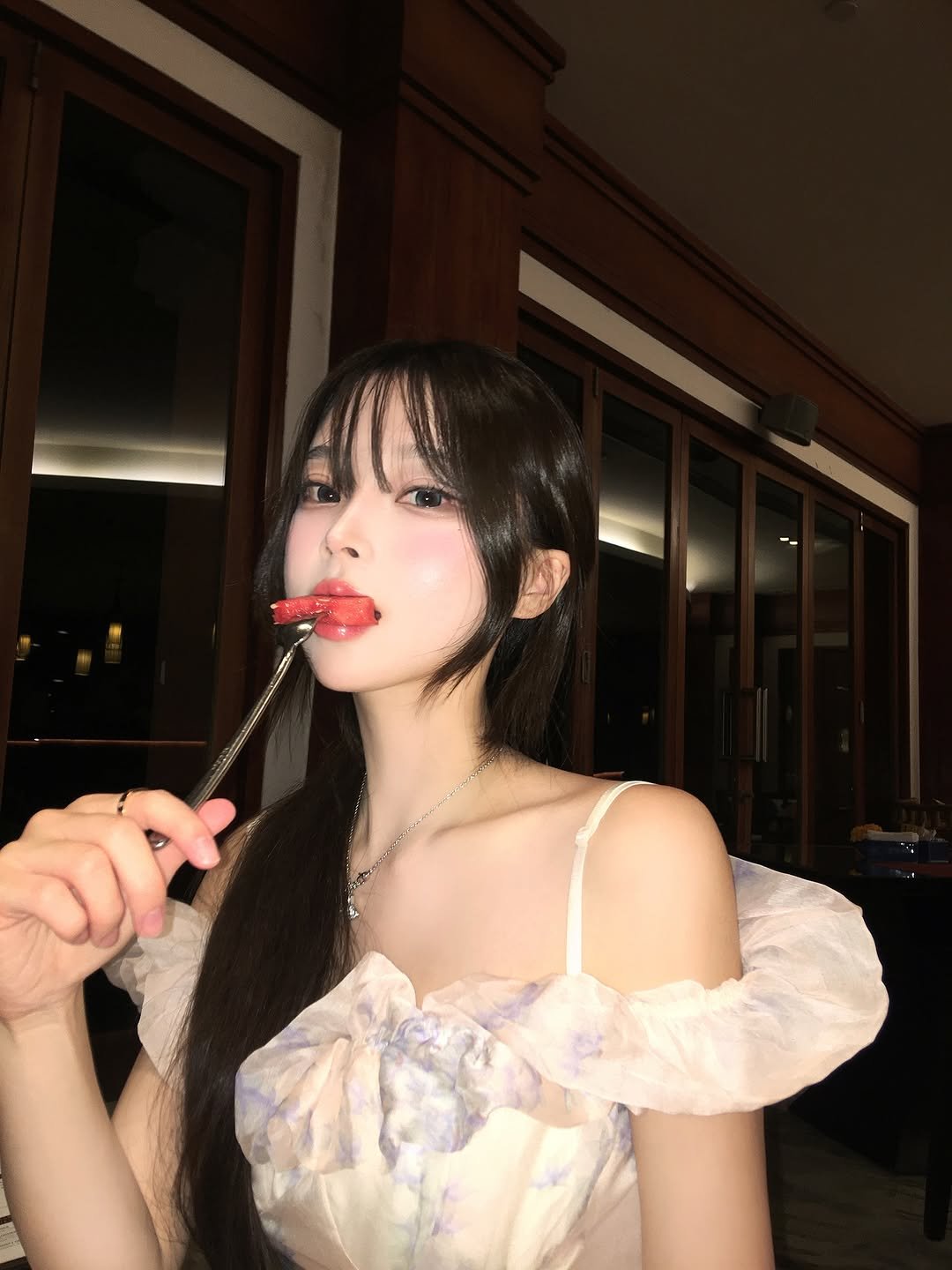 Photo by 오 지은 on September 02, 2025. May be an image of 1 person, hair, slip, cigarette, dress, lollipop and text.