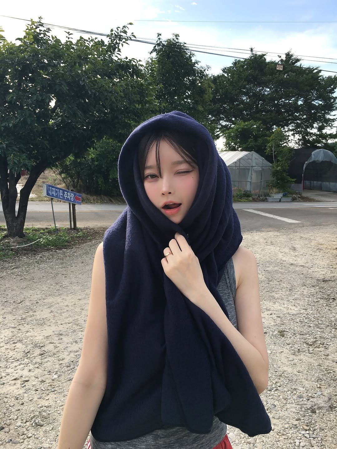 Photo by 오 지은 on August 16, 2025. May be an image of 1 person, headscarf, cloak, shawl, outdoors and text.