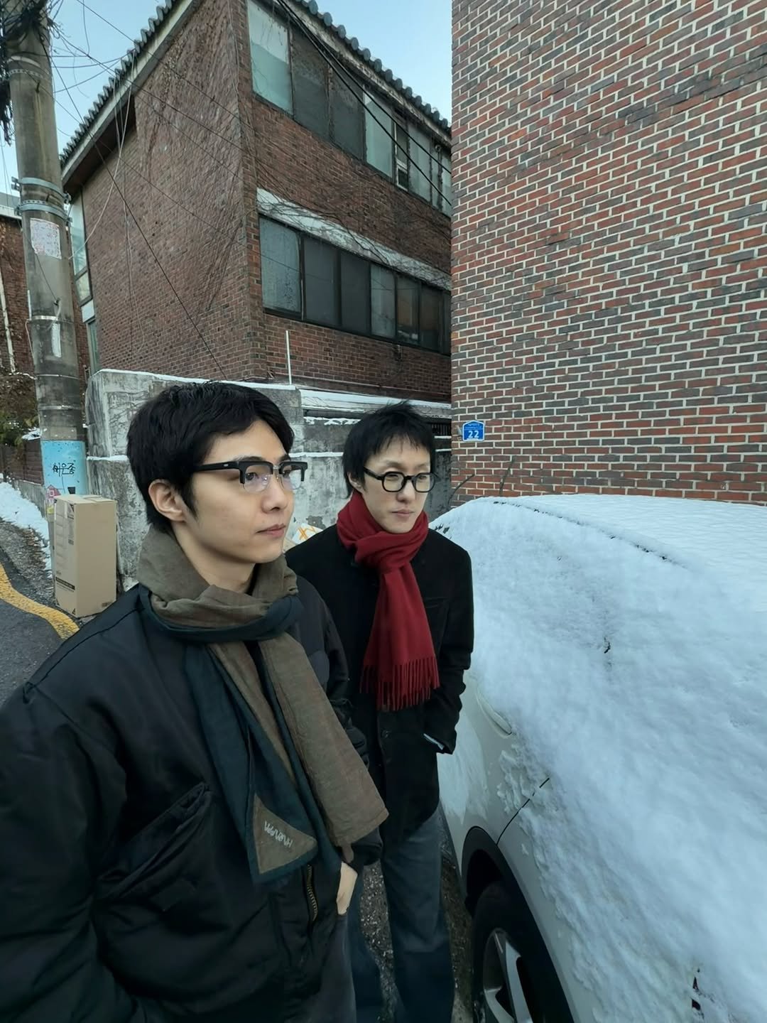 Photo shared by Zion.T on December 05, 2025 tagging @giriboy91. May be an image of standing, parka, scarf, snow and text.