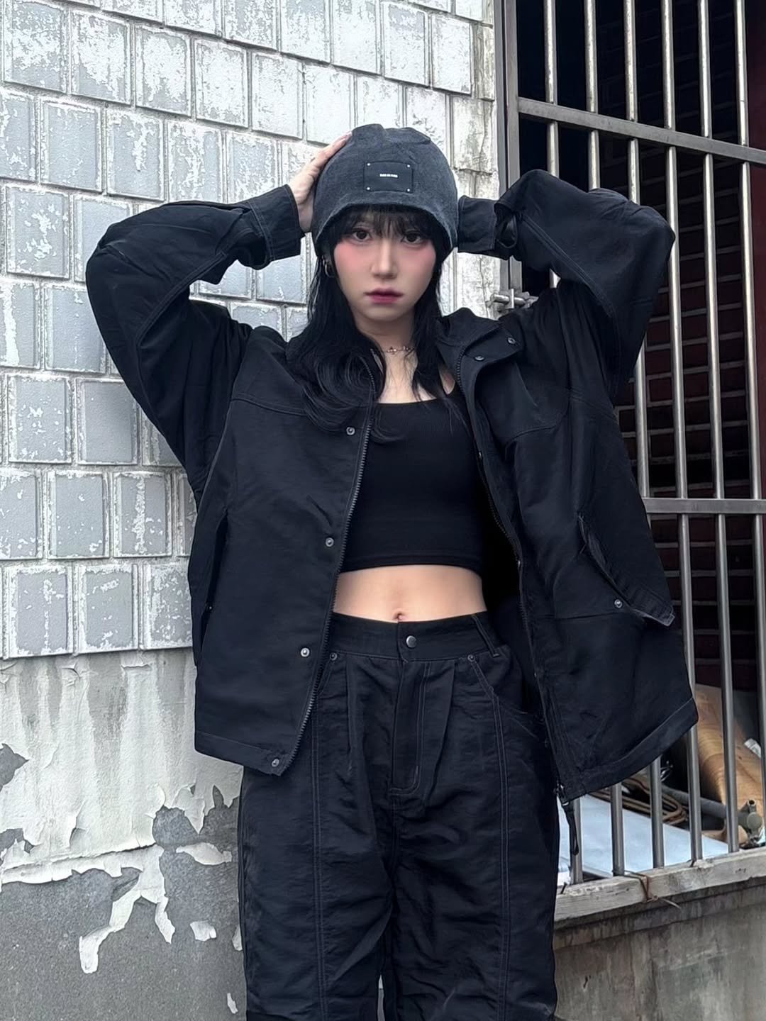 Photo shared by Nyx on March 25, 2026 tagging @1993studio_official. May be an image of hat, face mask, jacket, parka, sweatpants, sportswear, coat and text.